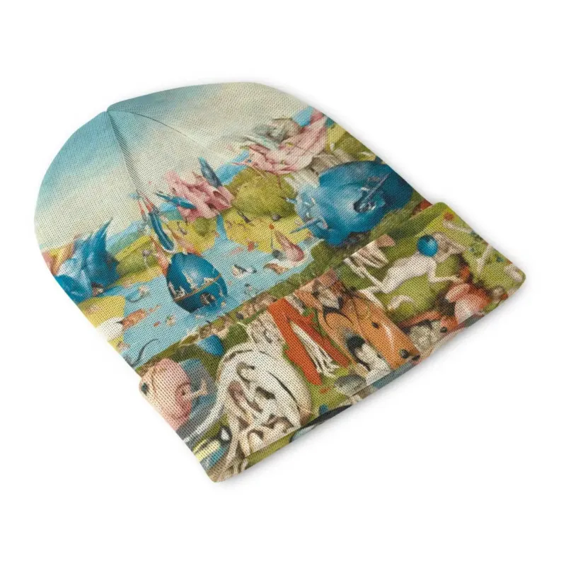 Front view of The Garden of Earthly Delights beanie with a pink architectural form rising above figures, animals and pale blue water.